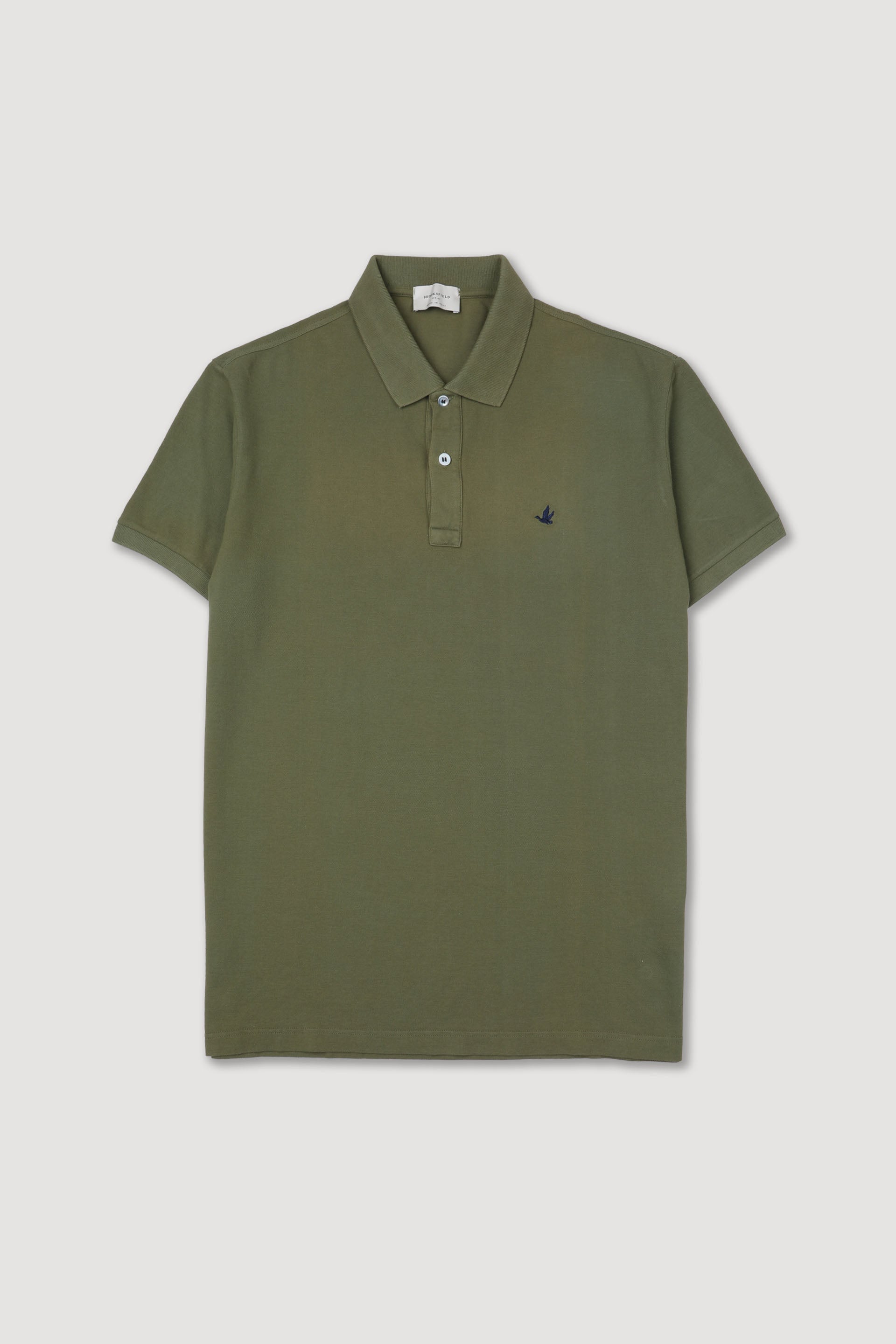 Polo in piquet di cotone con logo ricamato al cuore. Verde - Cipresso