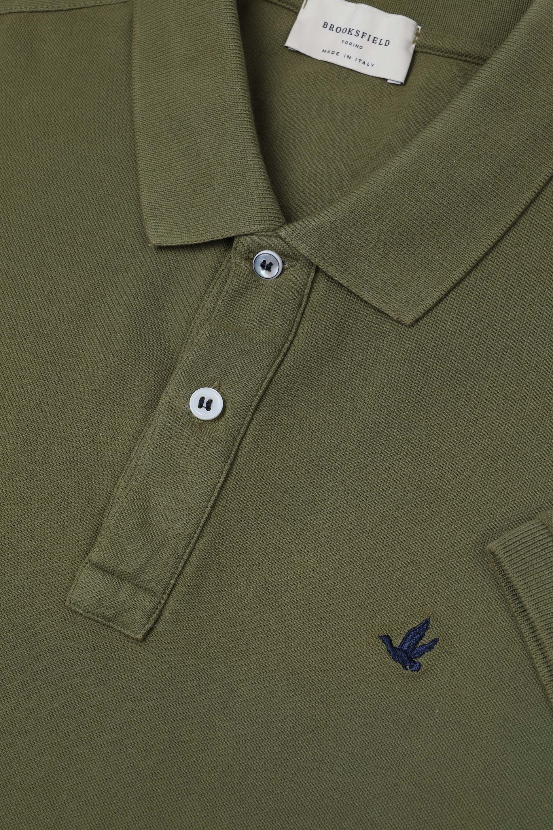 Polo in piquet di cotone con logo ricamato al cuore. Verde - Cipresso