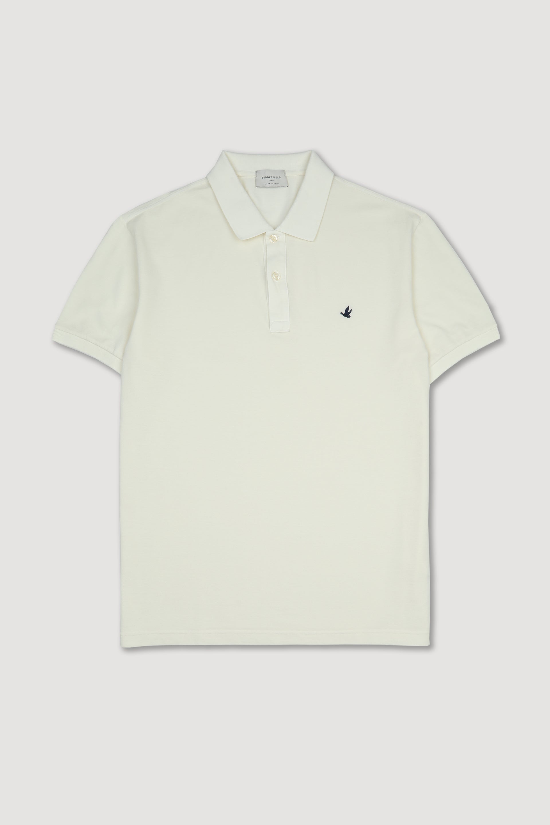 Polo in piquet di cotone con logo ricamato al cuore. Latte - Panna