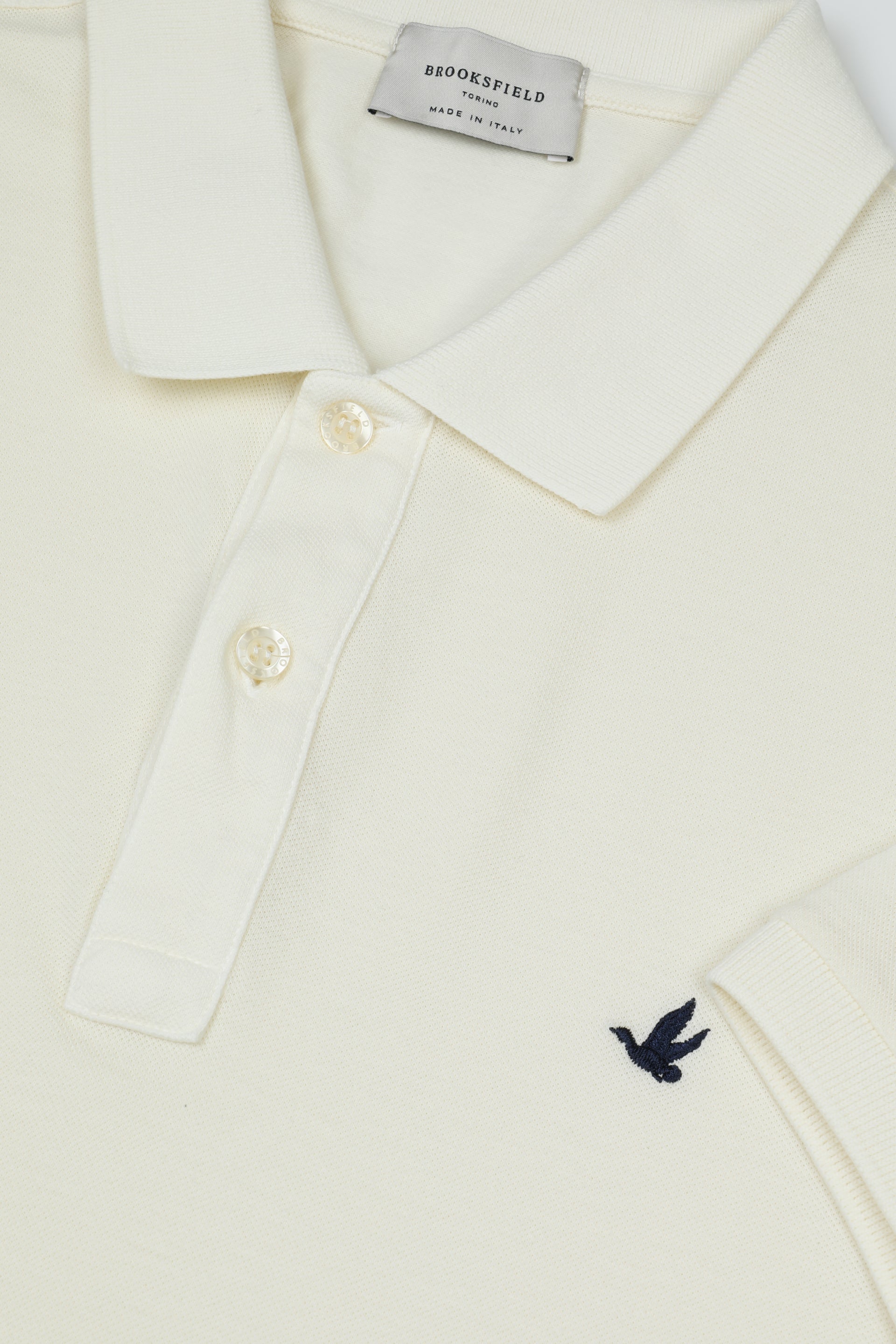 Polo in piquet di cotone con logo ricamato al cuore. Latte - Panna