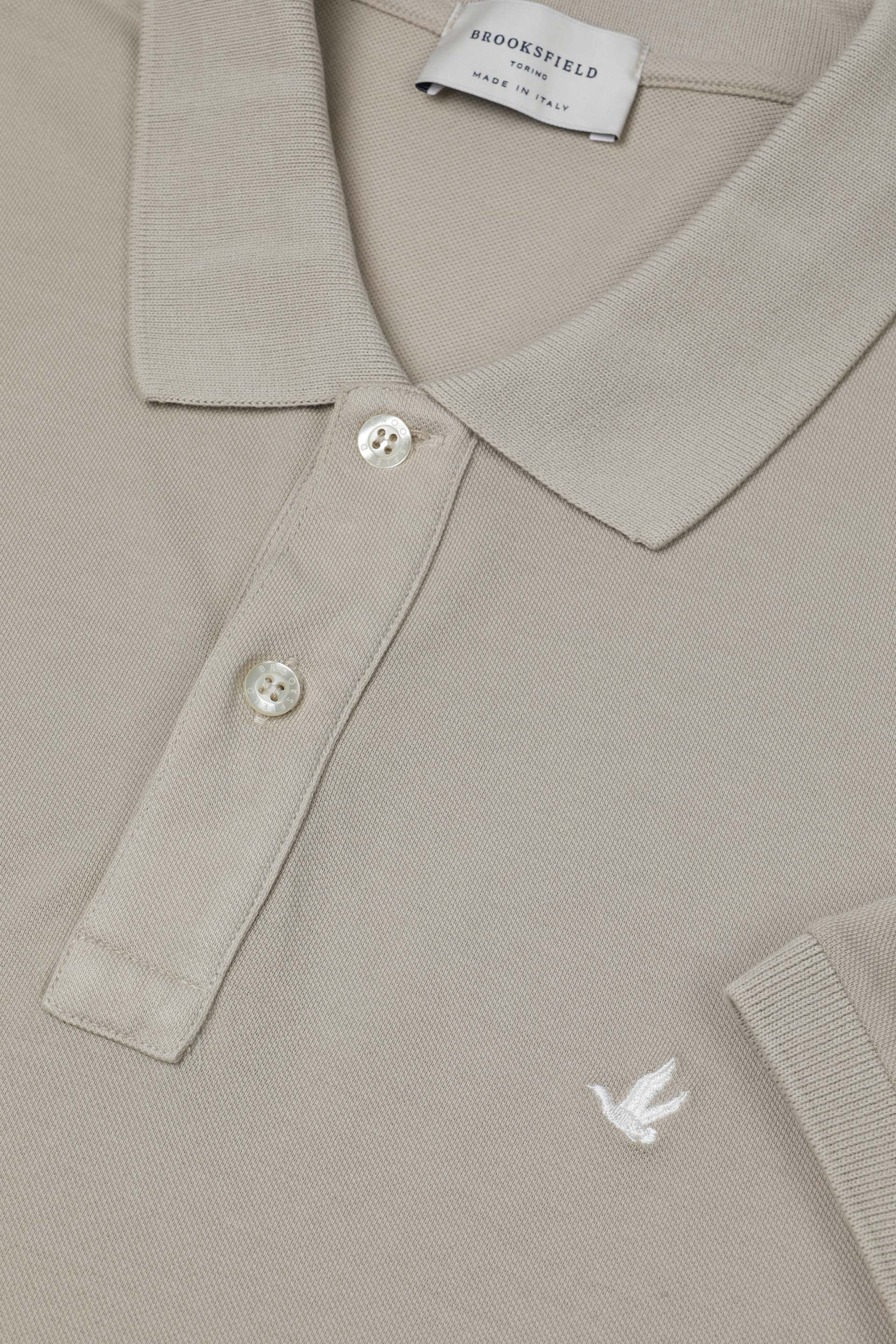 Polo in piquet di cotone con logo ricamato al cuore. Beige - Soft kaki