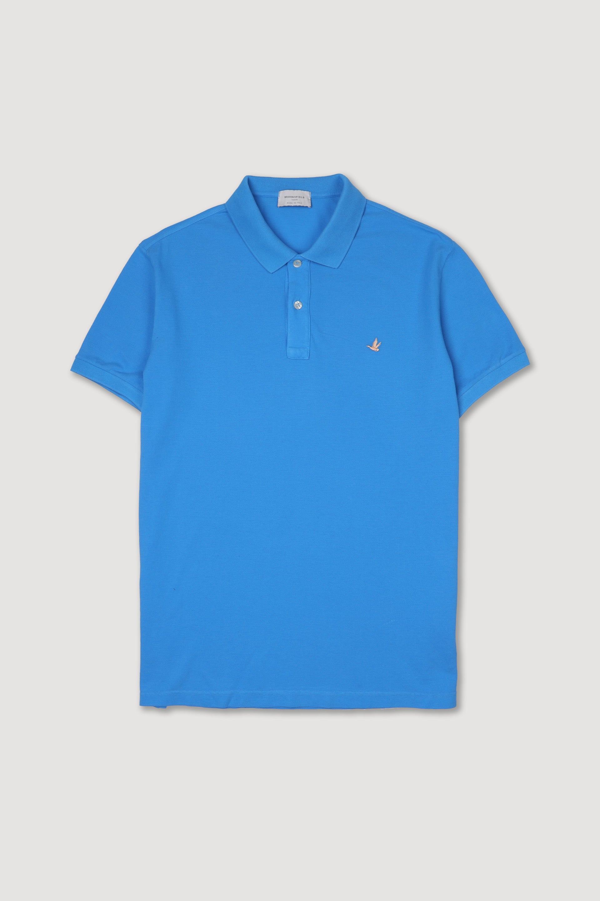 Polo in piquet di cotone con logo ricamato al cuore. Azzurro - Ultramarine