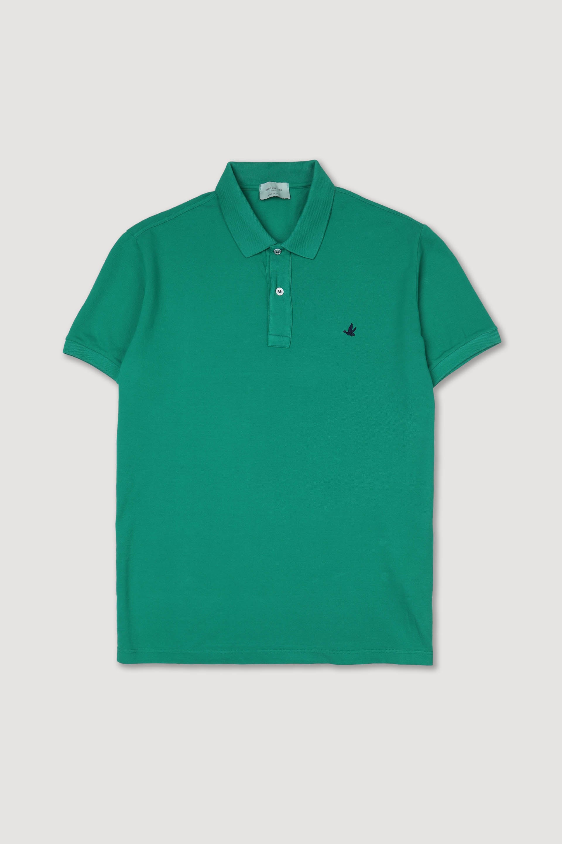 Polo in piquet di cotone con logo ricamato al cuore. Verde - Flag green
