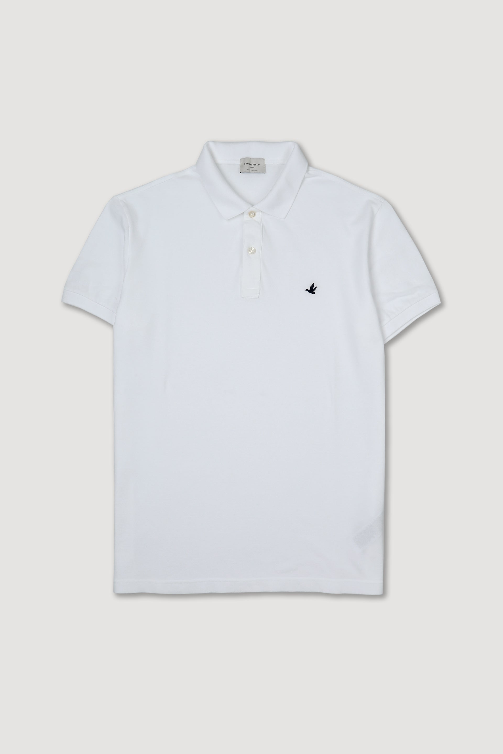 Polo in piquet di cotone con logo ricamato al cuore. Bianco - White