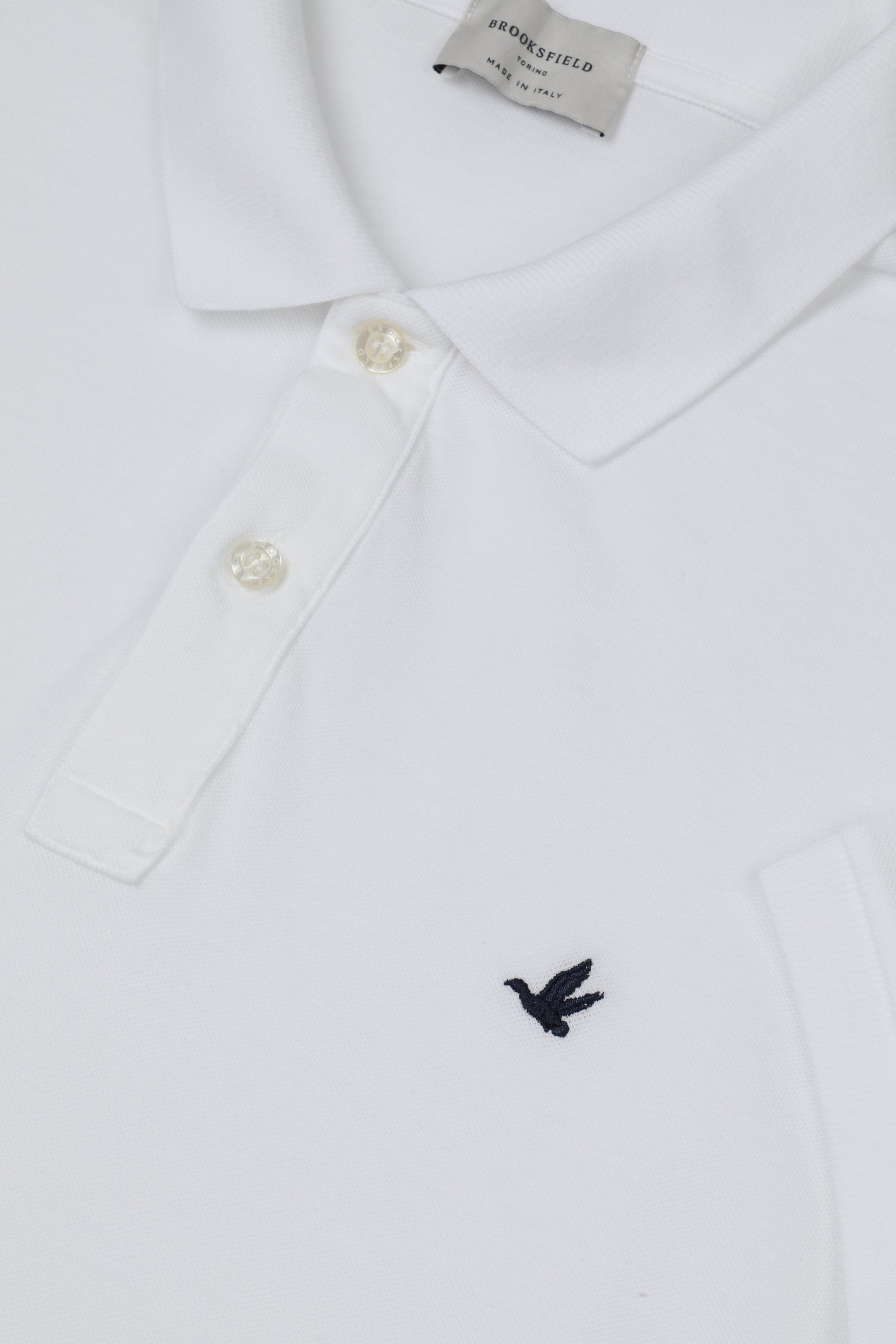 Polo in piquet di cotone con logo ricamato al cuore. Bianco - White