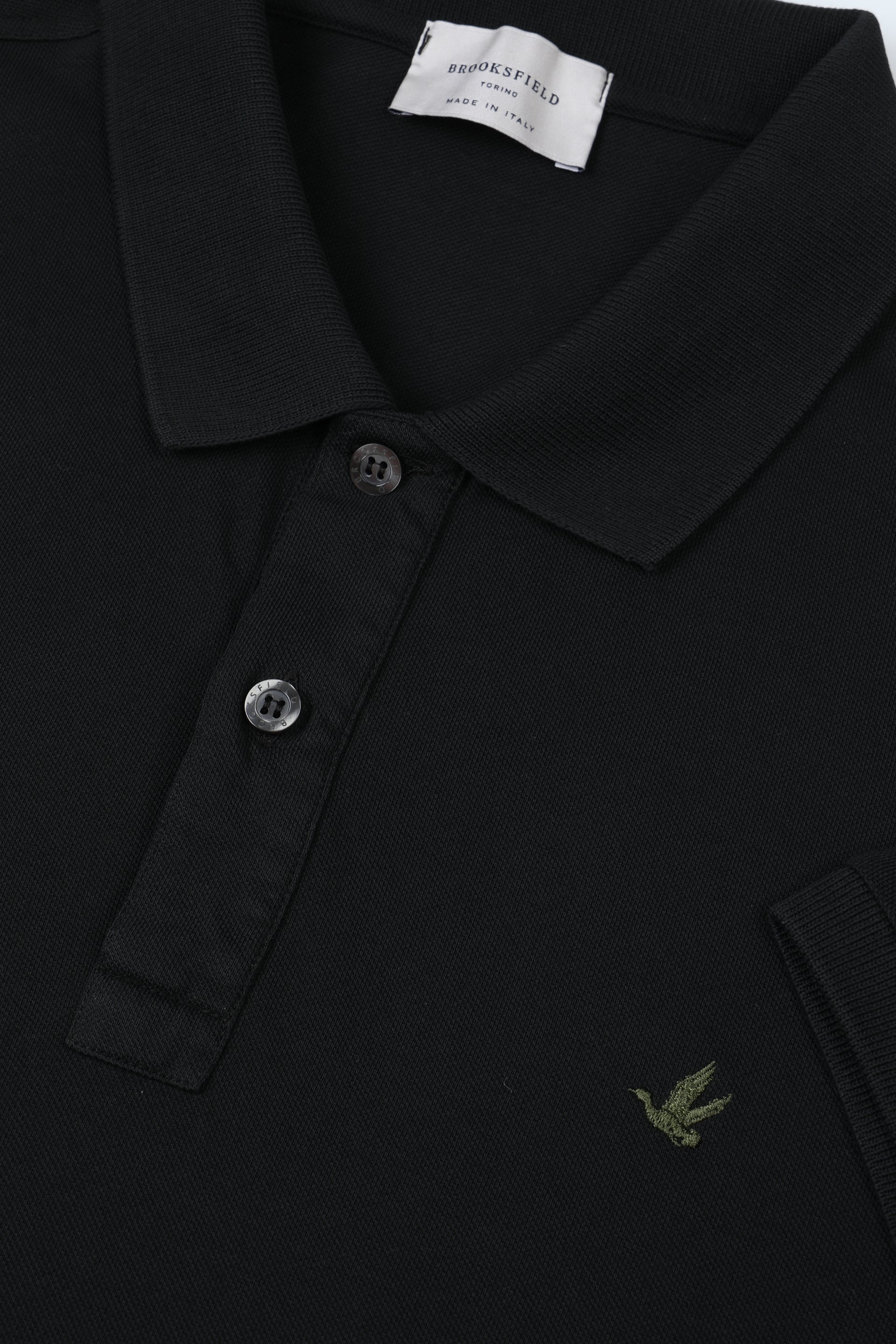 Polo in piquet di cotone con logo ricamato al cuore. Nero - Black