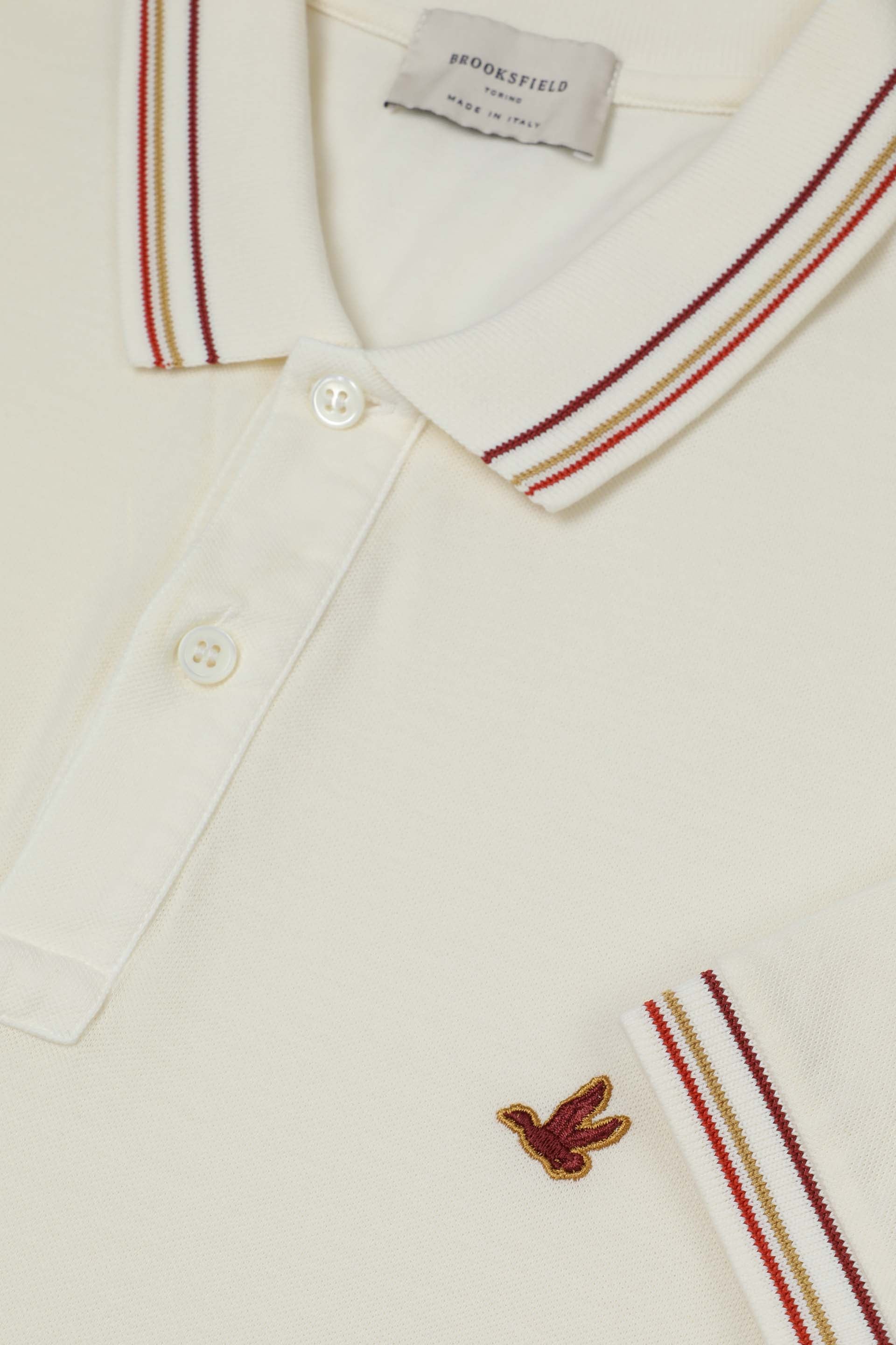 Polo in piquet di cotone con collo e polsi rigati. Logo ricamato al cuore - Bianco lana