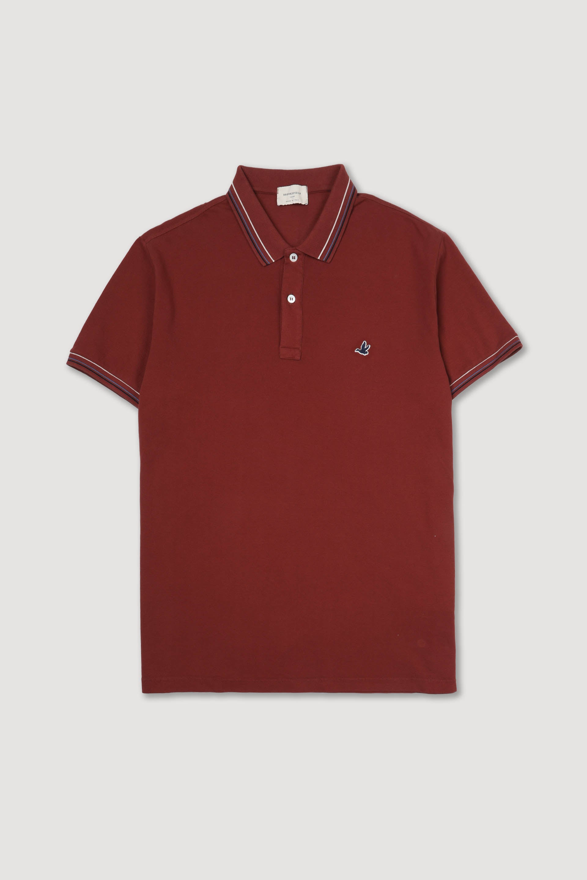 Polo in piquet di cotone con collo e polsi rigati. Logo ricamato al cuore. Rosso - Tabasco