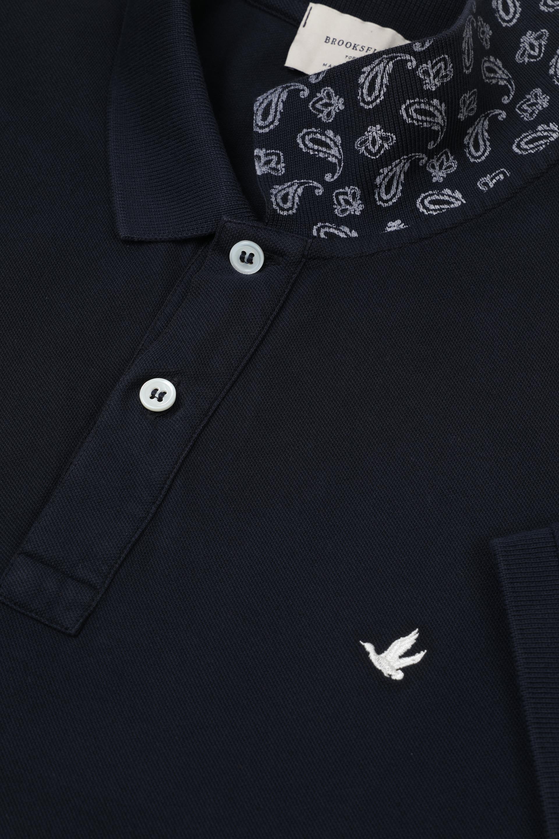 Polo in piquet di cotone, sottocollo stampato. Logo ricamato al cuore. Blu - Navy