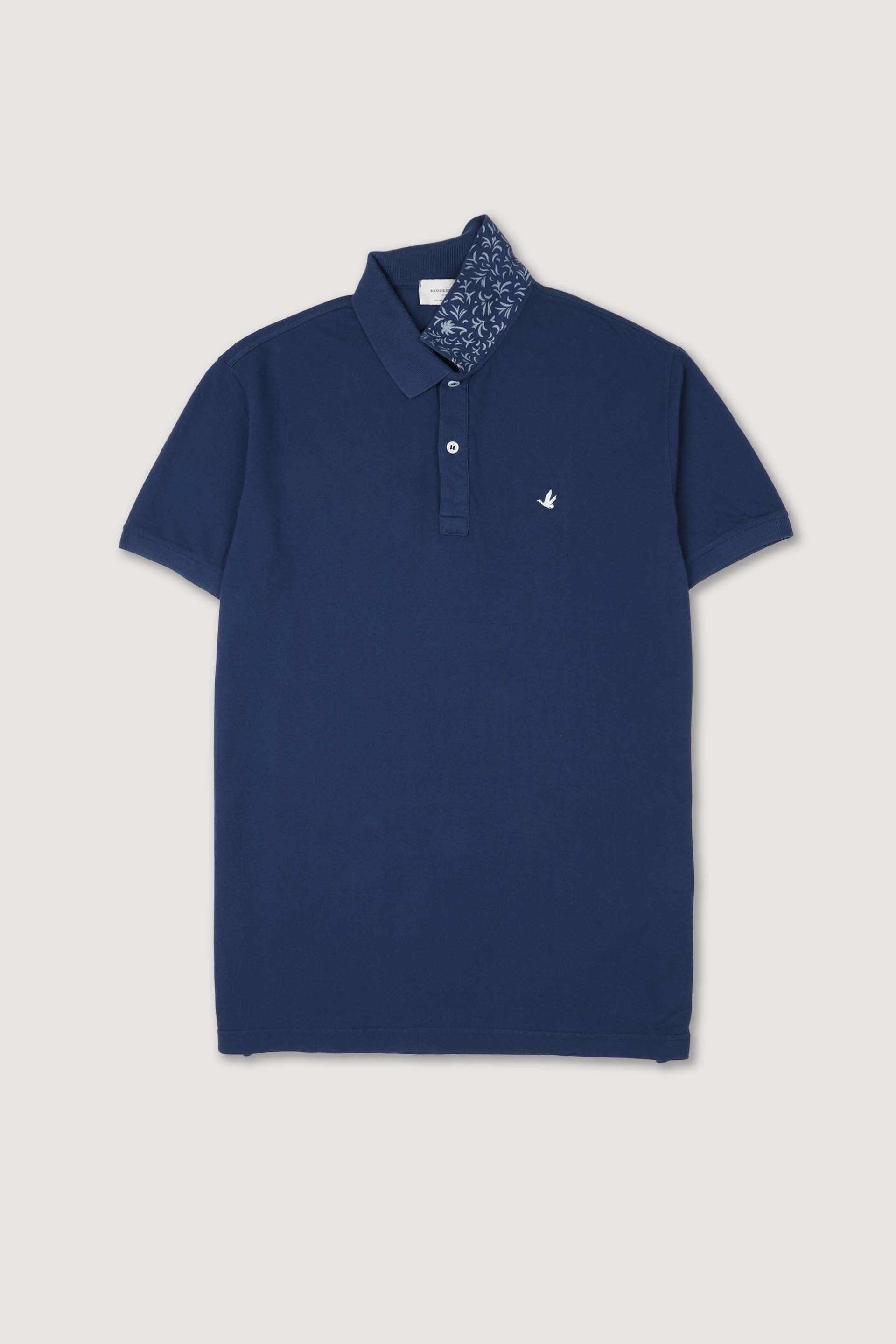Polo in piquet di cotone, sottocollo stampato. Logo ricamato al cuore. Blu - Denim