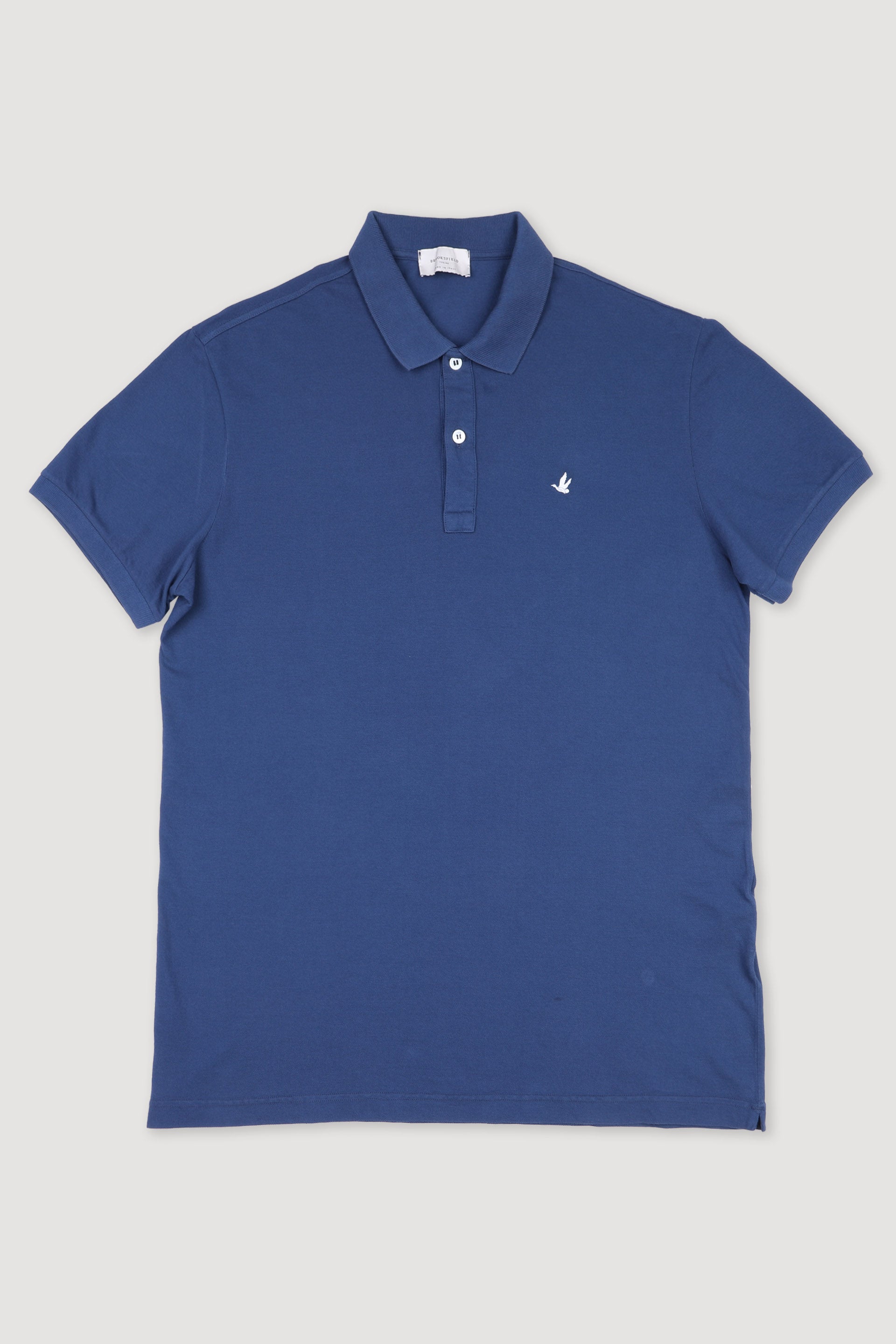Polo in piquet di cotone, sottocollo stampato. Logo ricamato al cuore. Blu - Denim
