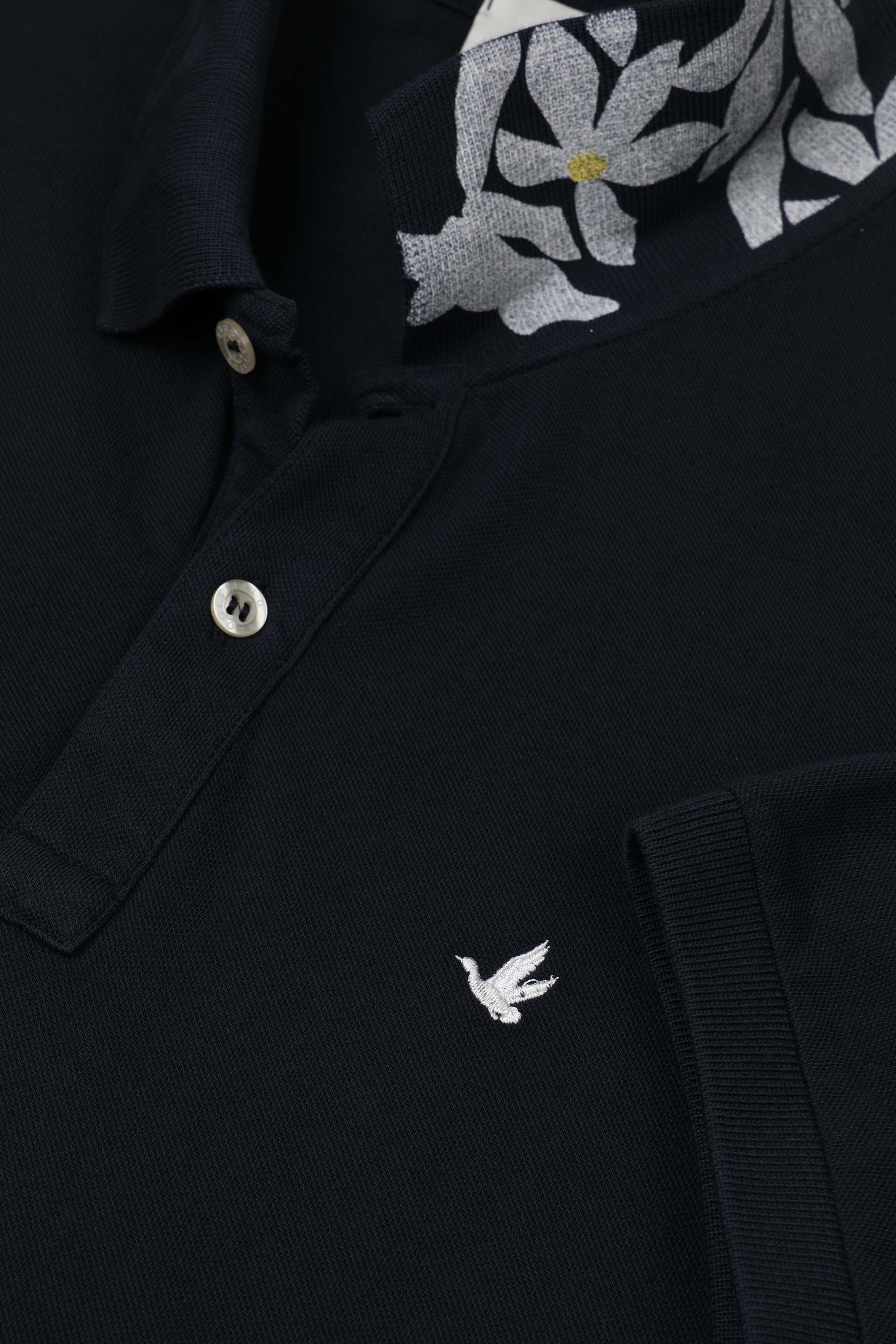 Polo in piquet di cotone, sottocollo stampato. Logo ricamato al cuore. Verde - Navy