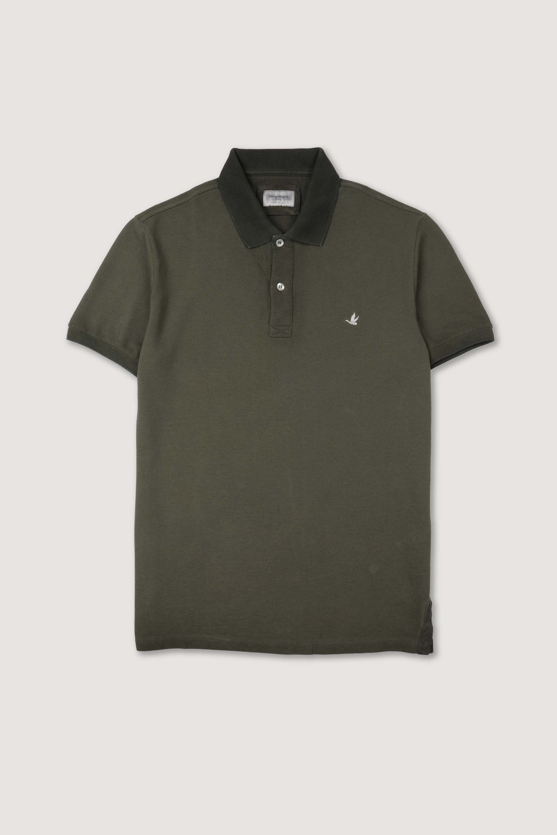 Polo in piquet di cotone, tintura effetto sun faded. Logo ricamato al cuore. Verde - Alligator