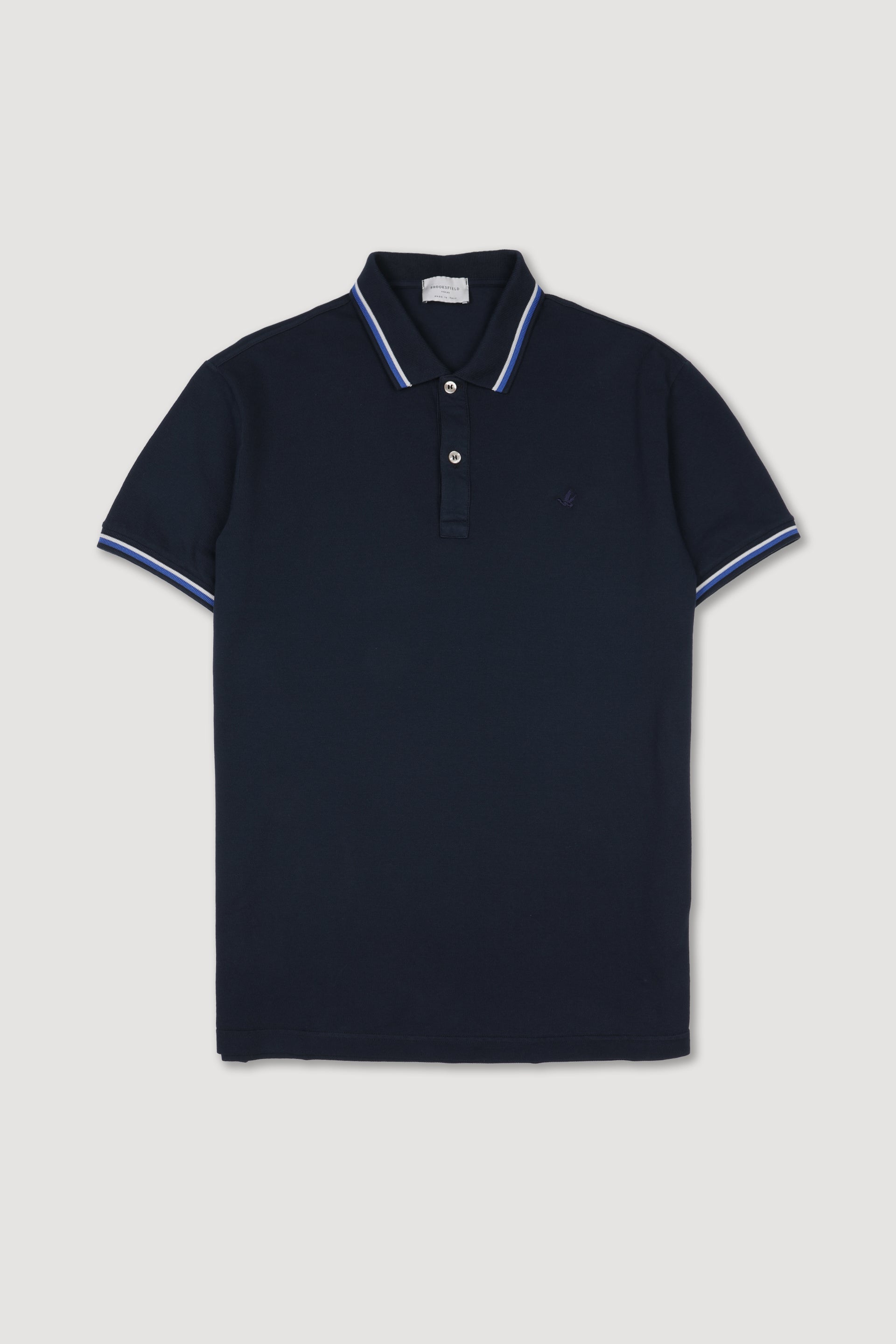 Polo in piquet di cotone con collo e polsi rigati. Logo ricamato al cuore. Blu - Navy