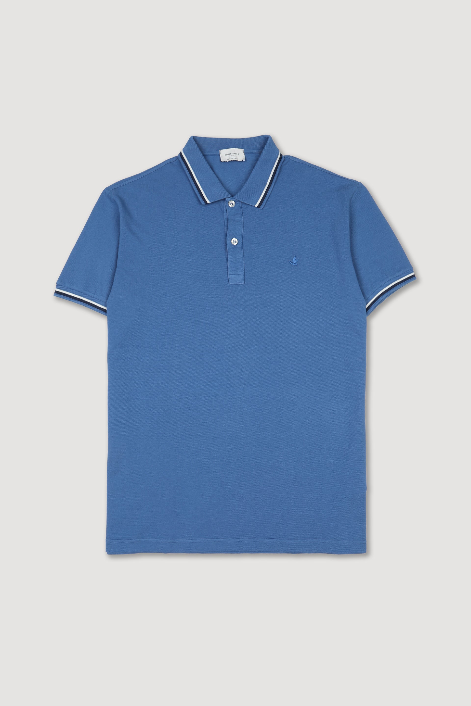 Polo in piquet di cotone con collo e polsi rigati. Logo ricamato al cuore. Blu - Acquario