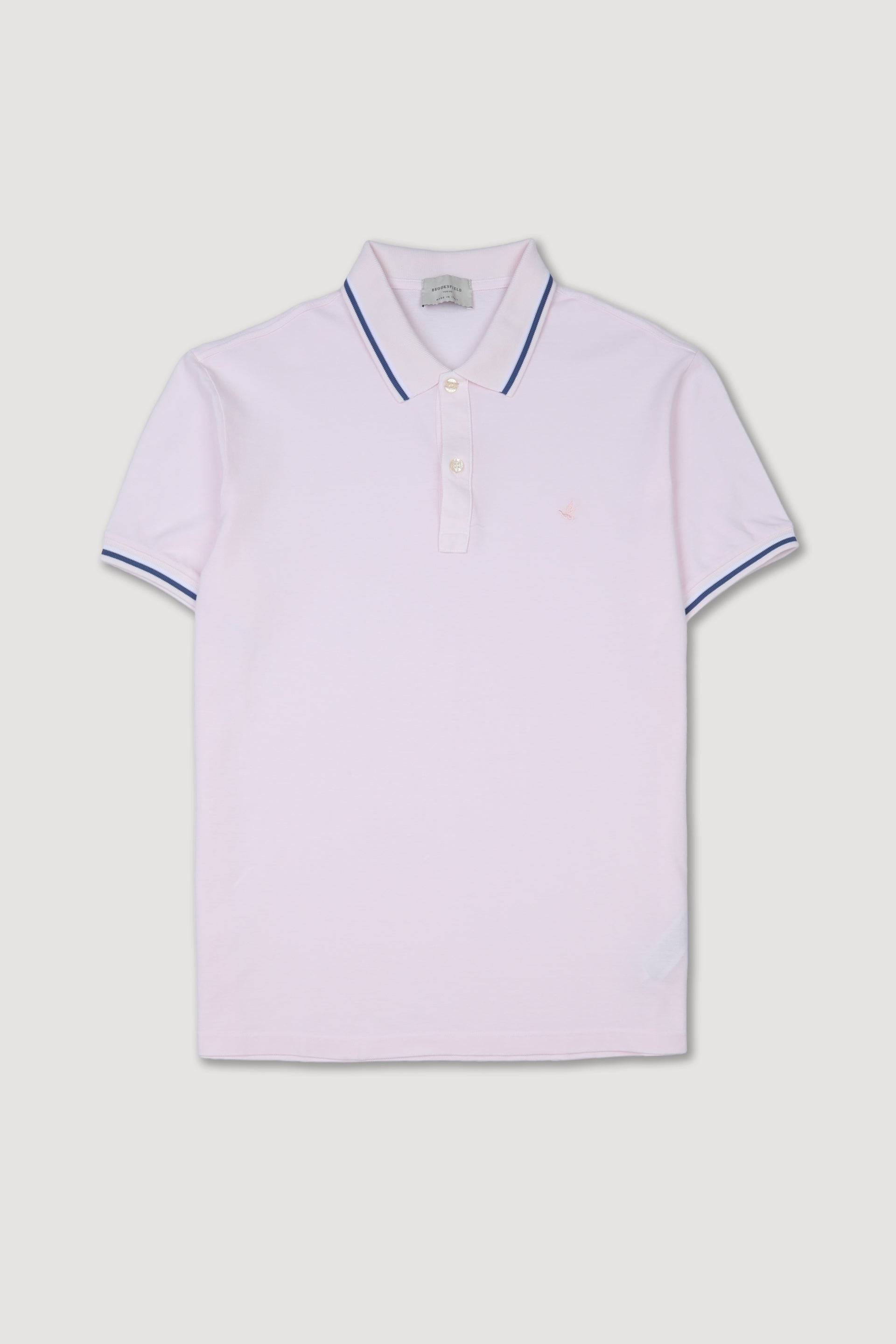 Polo in piquet di cotone con collo e polsi rigati. Logo ricamato al cuore. Rosa - Conchiglia