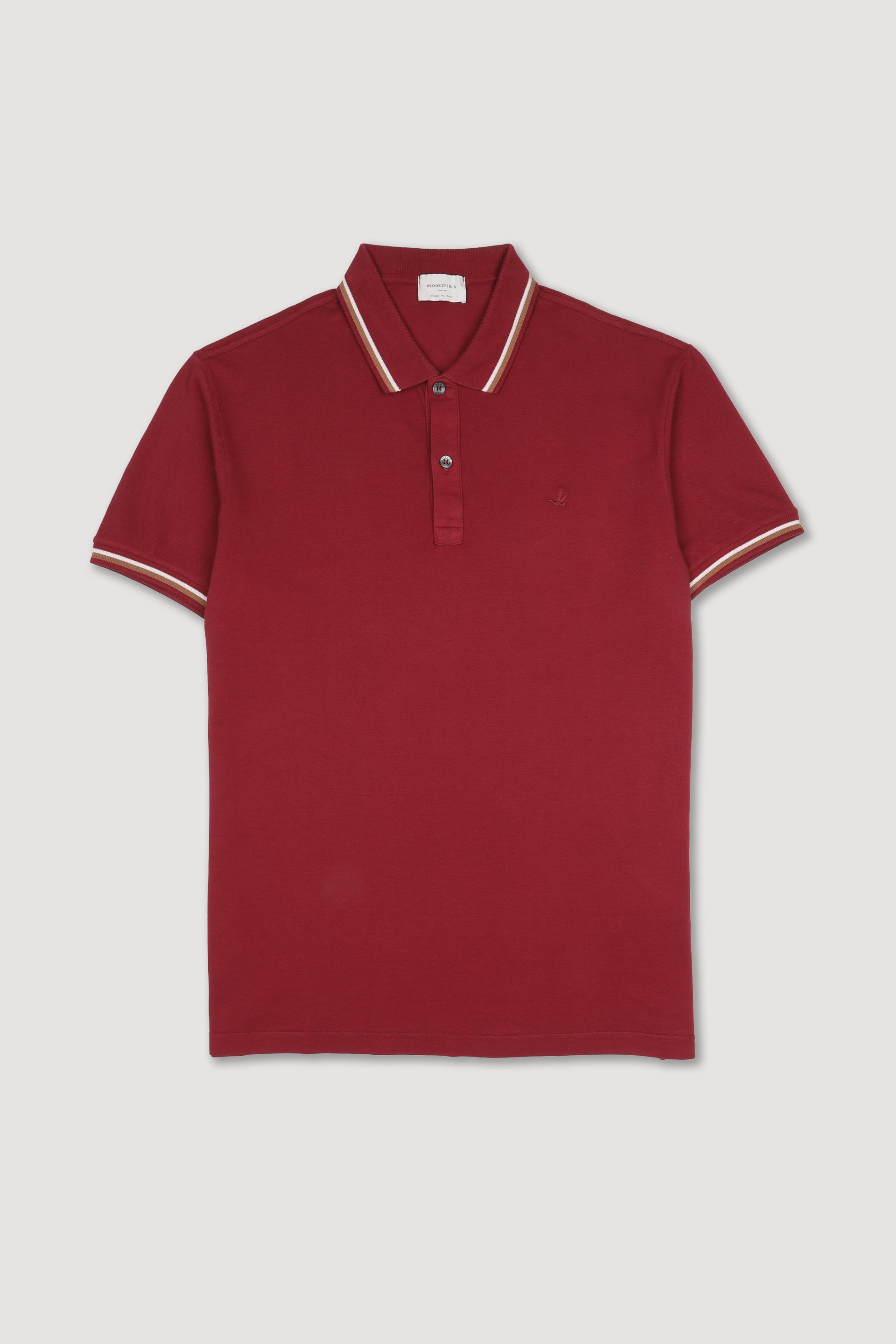 Polo in piquet di cotone con collo e polsi rigati. Logo ricamato al cuore. Rosso - Cardinale