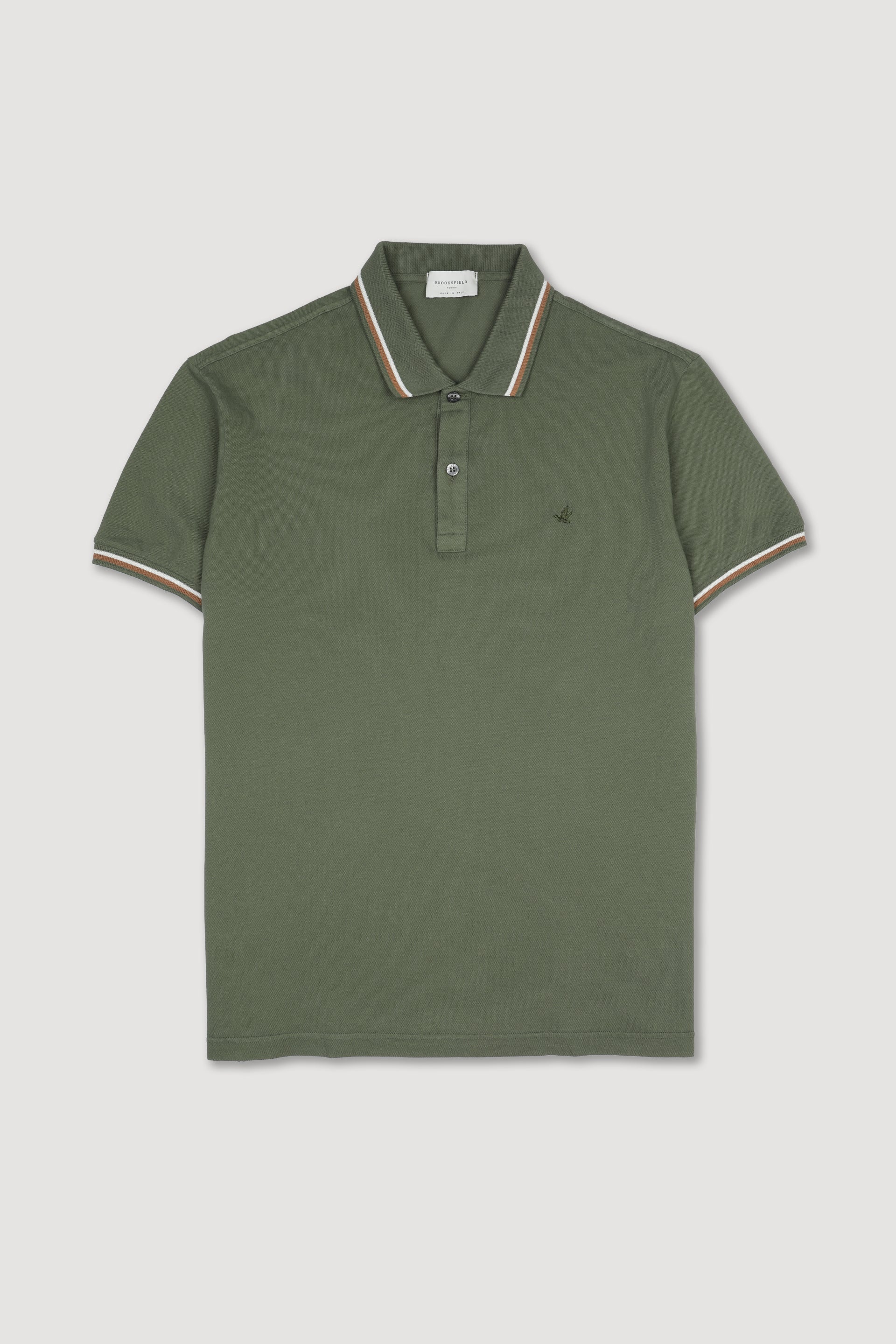Polo in piquet di cotone con collo e polsi rigati. Logo ricamato al cuore. Verde - Alligator