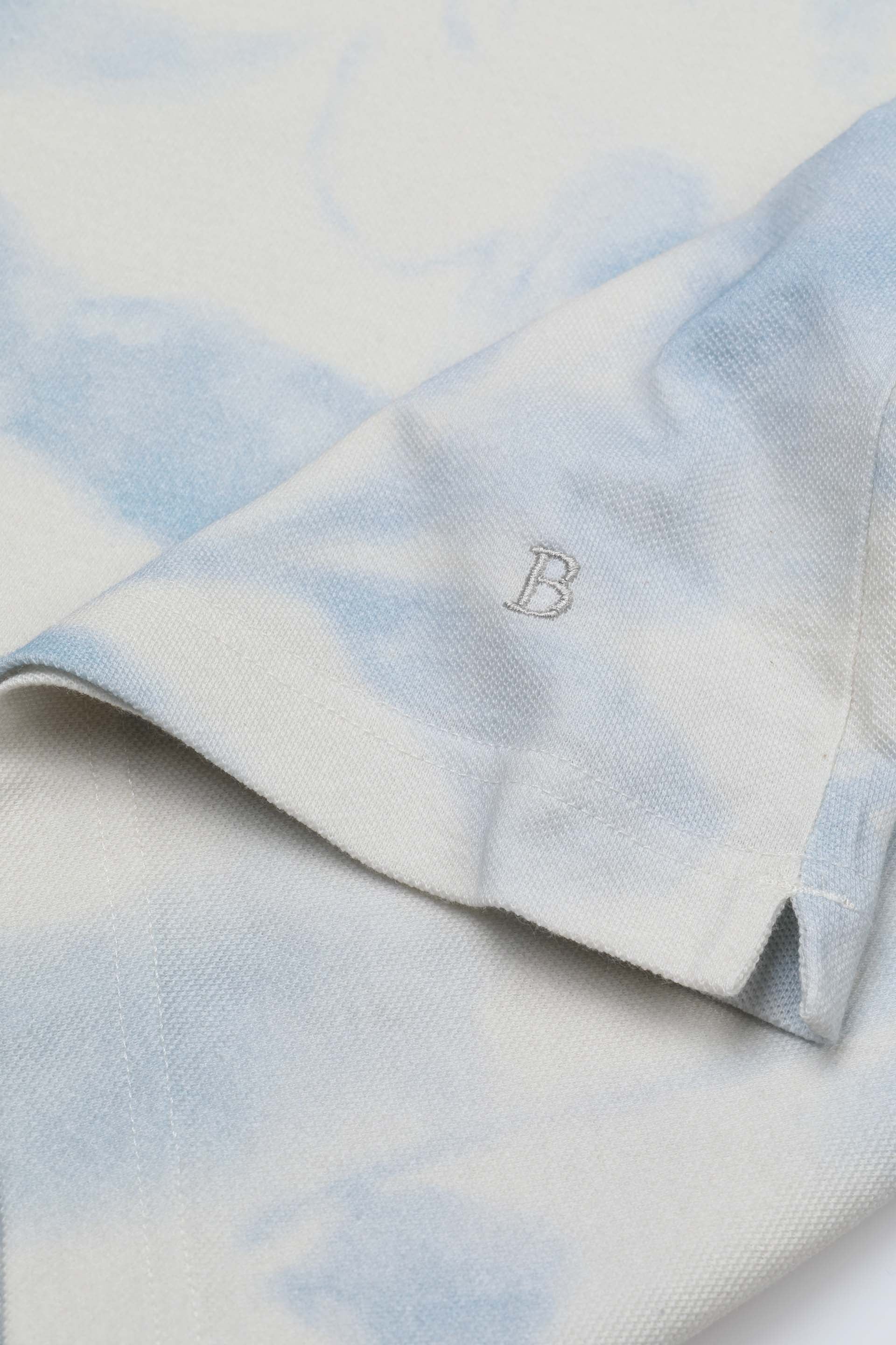 Polo collo aperto in piquet di cotone con stampa. Azzurro - Celeste