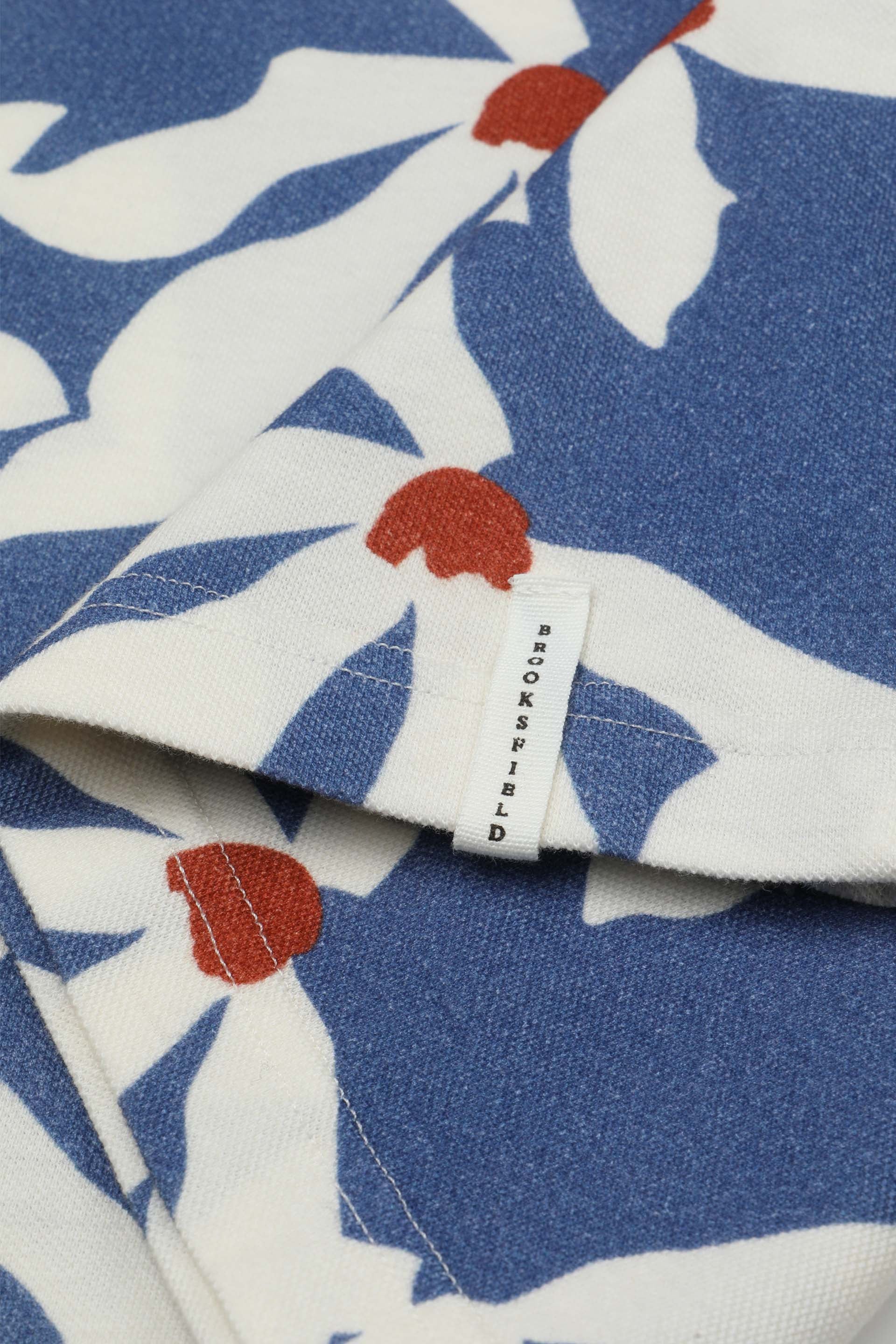 Polo collo aperto in piquet di cotone, stampa Magnolia. Blu - Sailor/Avorio