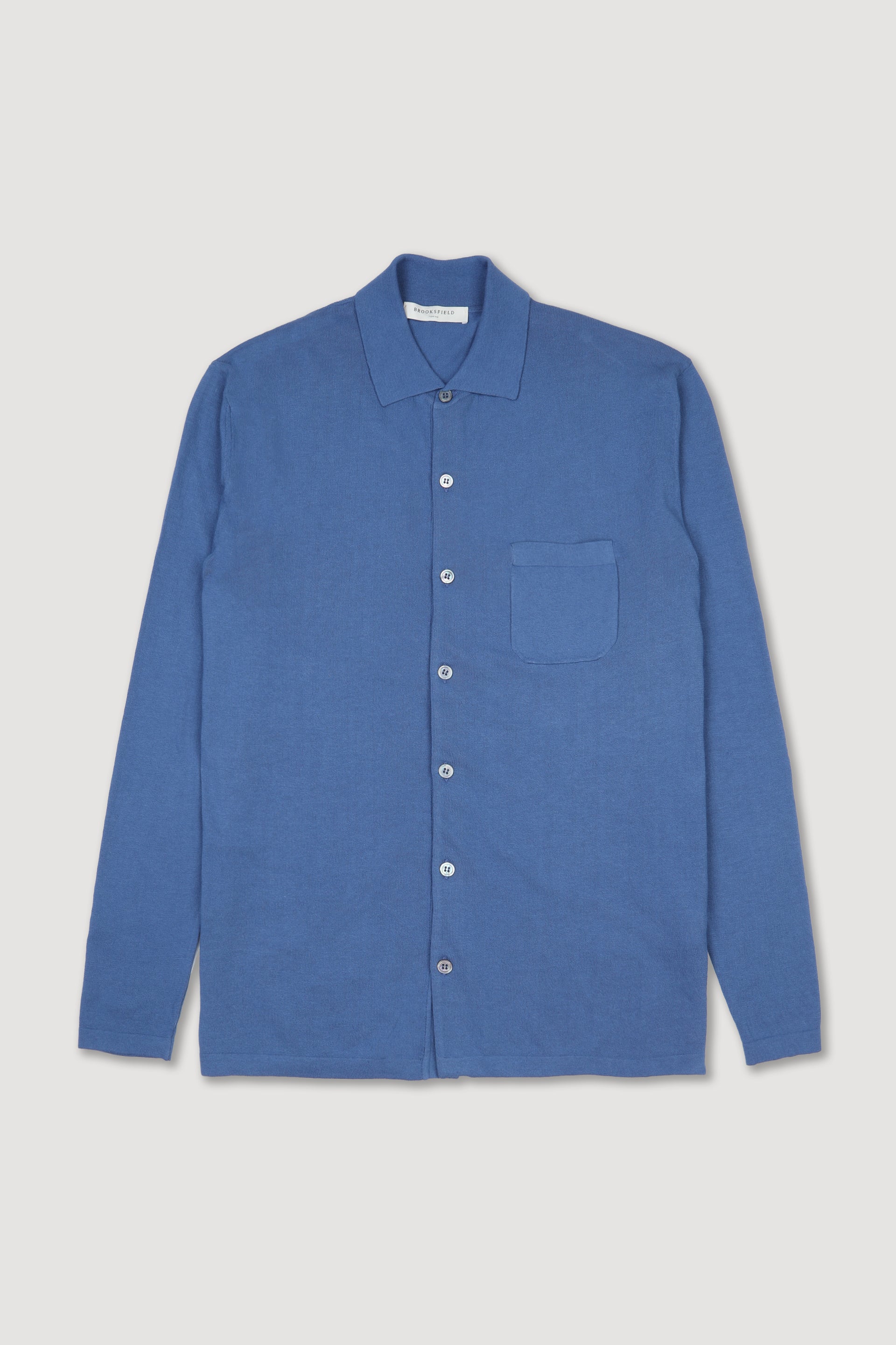 Giacca in maglia con taschino al cuore realizzata in cotone. Blu - Acquario