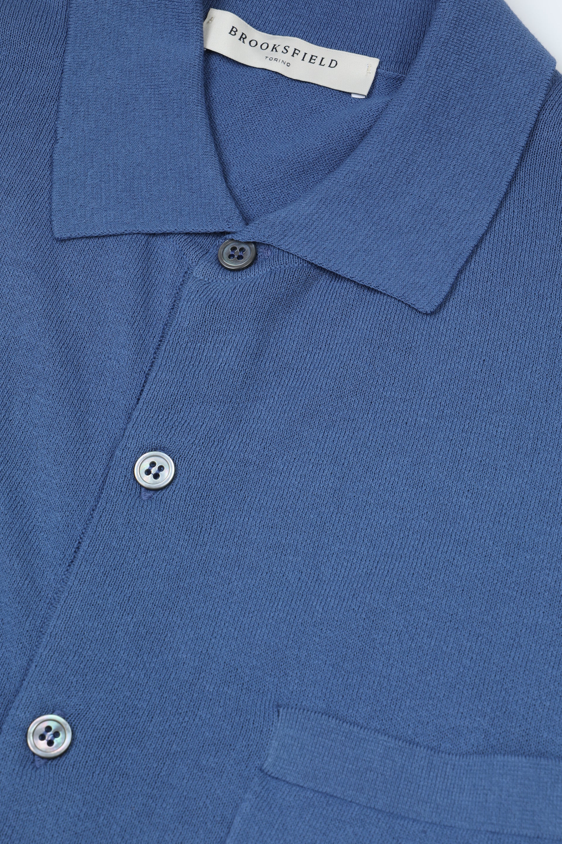 Giacca in maglia con taschino al cuore realizzata in cotone. Blu - Acquario