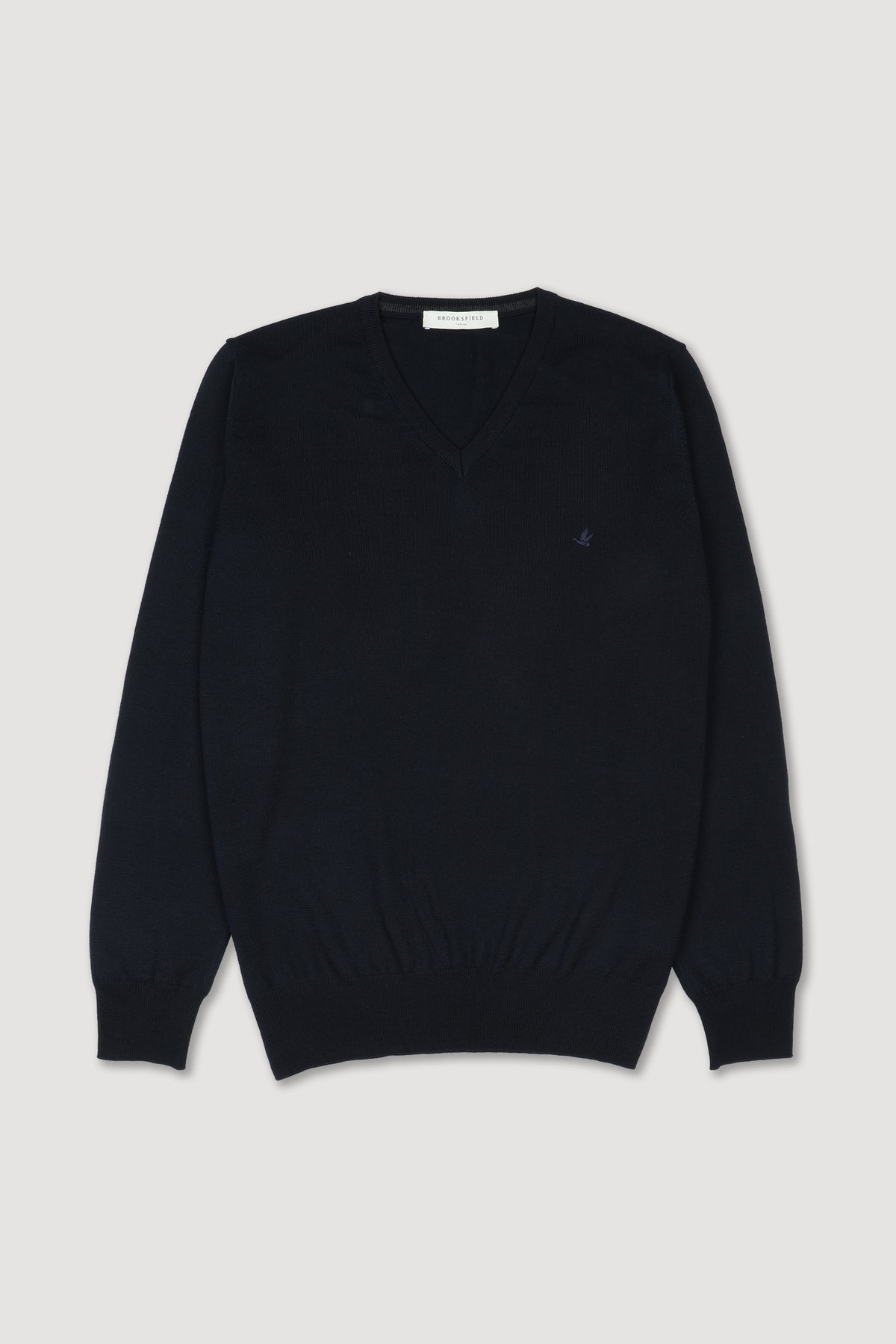 Maglia scollo V in lana merinos extrafine con logo ricamato al cuore. Blu - Navy
