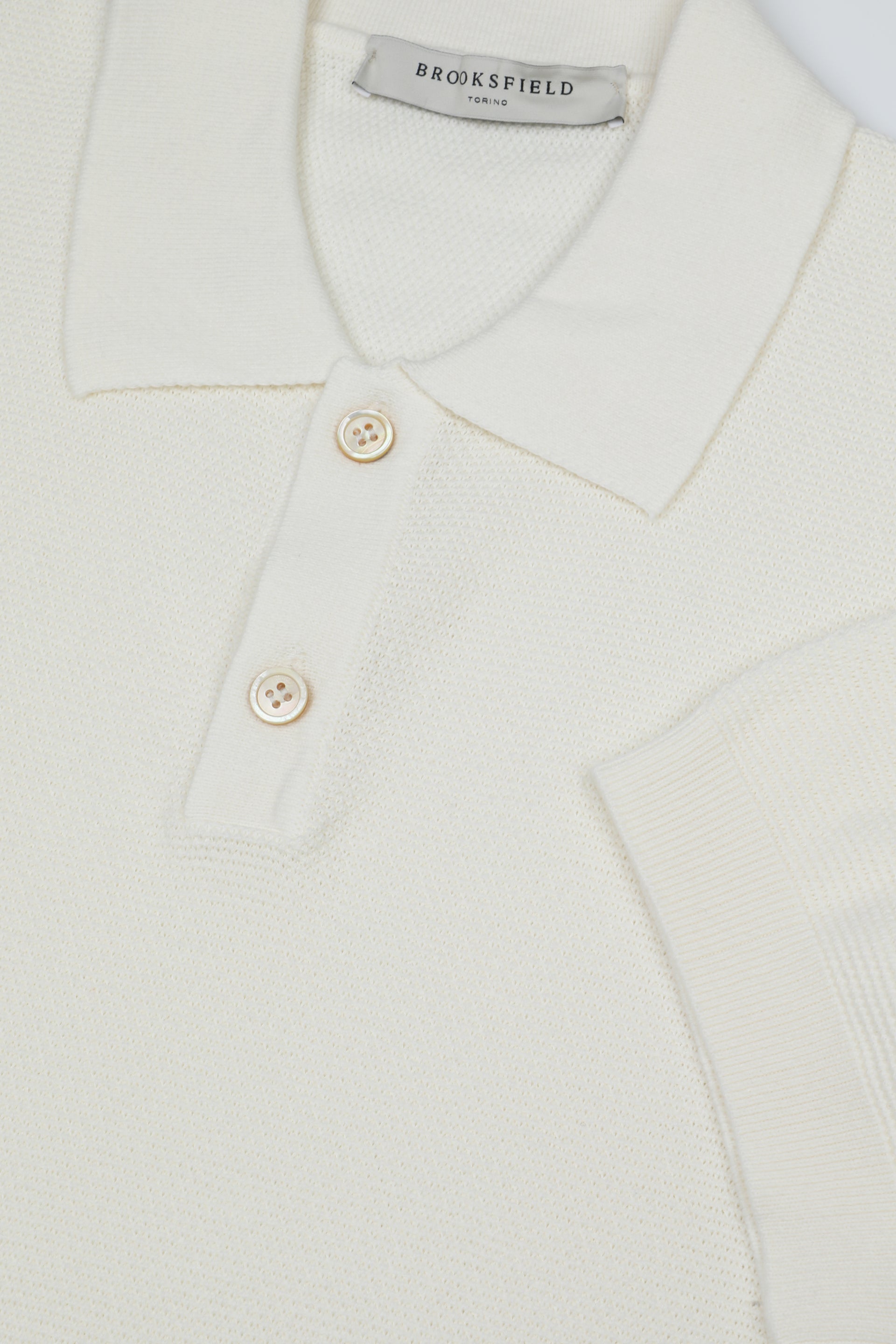 Polo in maglia realizzata in cotone con motivo grana di riso - Panna