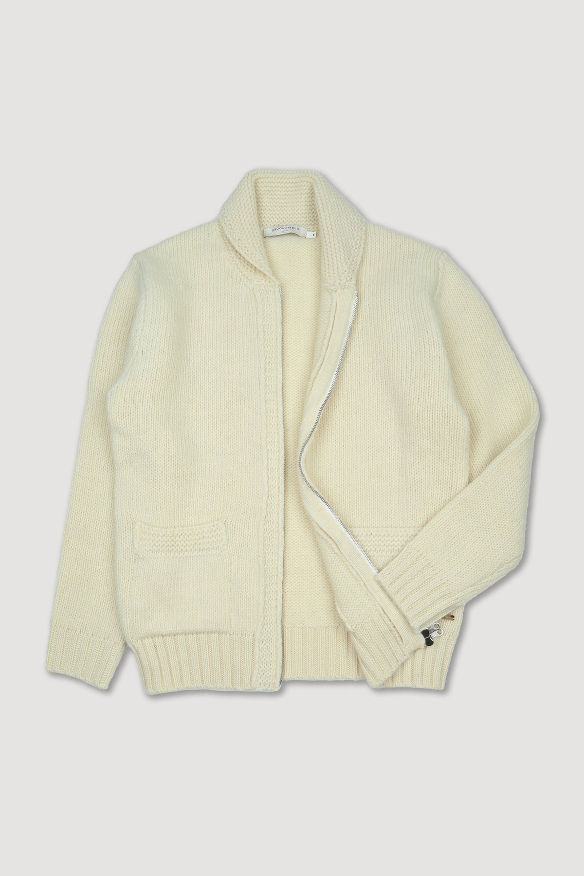 Giubbotto in maglia con zip realizzato in pura lana vergine. Panna - Avorio