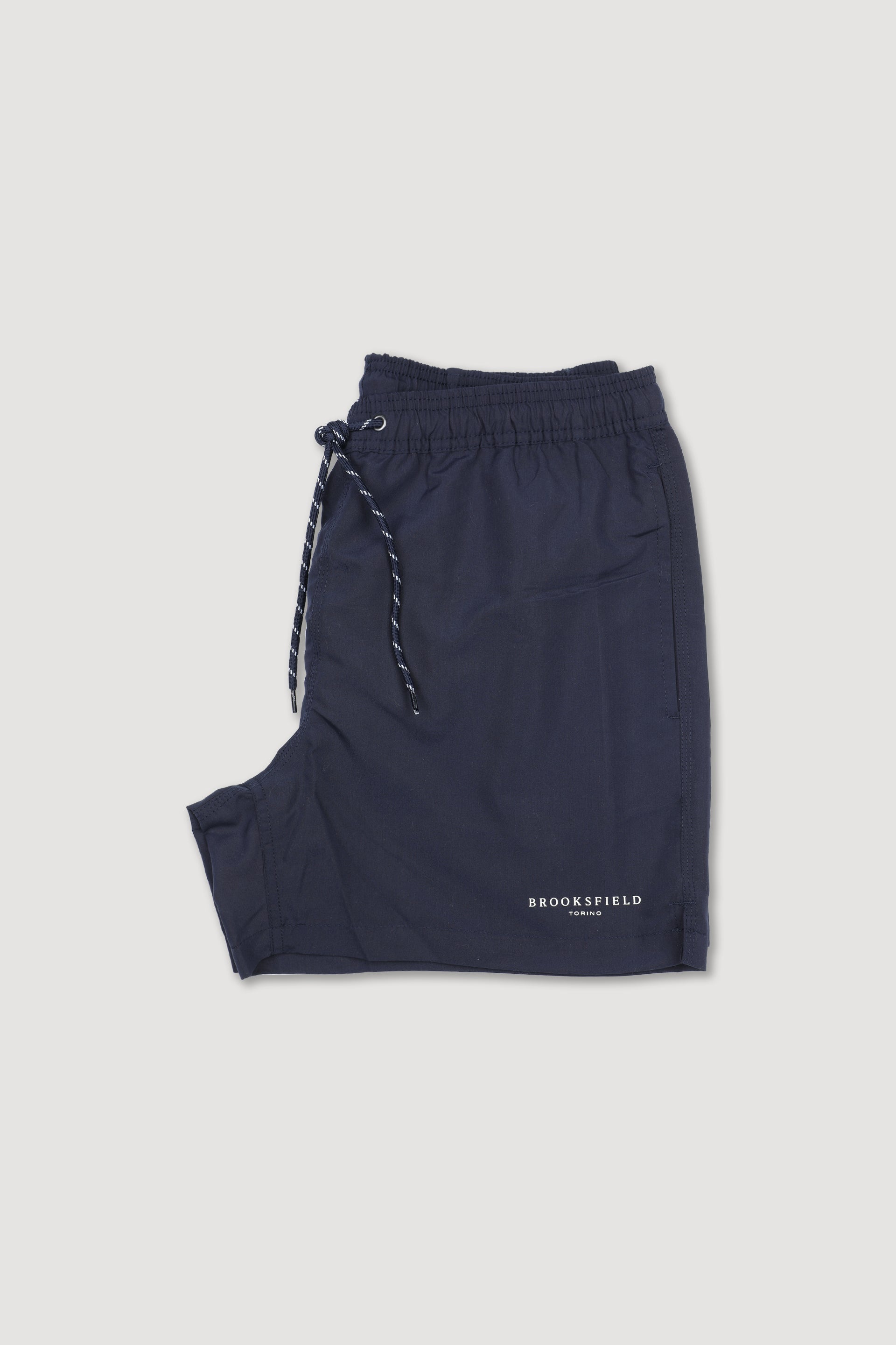 UOMO-BOXER MARE IN MICROFIBRA TINTA UNITA, TASCHE LATERALI, TASCHINO CON ALETTA APPLICATO DIETRO, ELASTICO E COULISSE IN VITA, STAMPA MARCHIO SU GAMBA - Navy