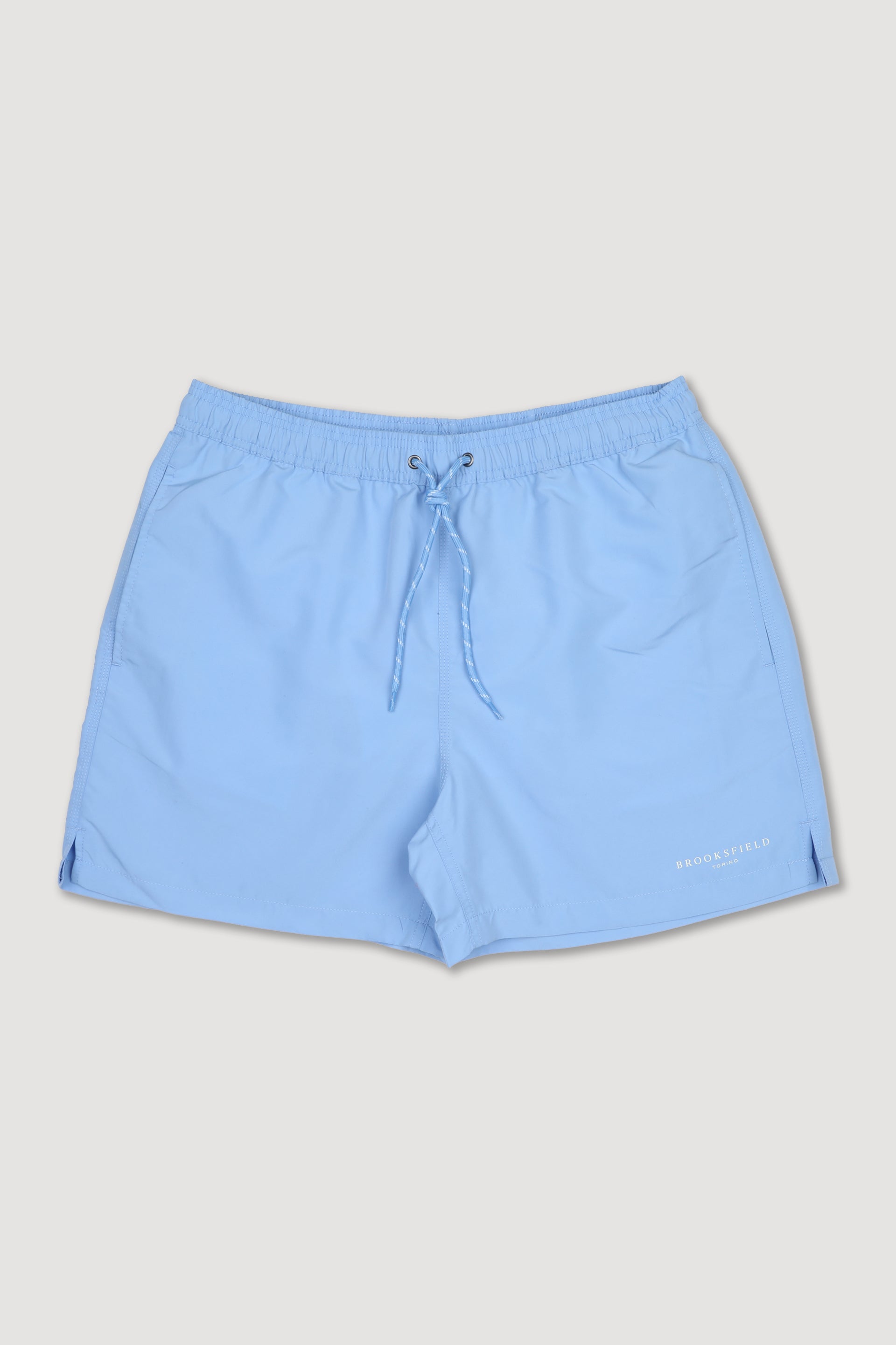 UOMO-BOXER MARE IN MICROFIBRA TINTA UNITA, TASCHE LATERALI, TASCHINO CON ALETTA APPLICATO DIETRO, ELASTICO E COULISSE IN VITA, STAMPA MARCHIO SU GAMBA - Sky blue